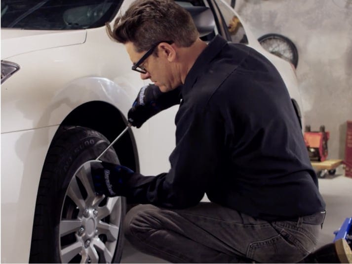 man working on brakes