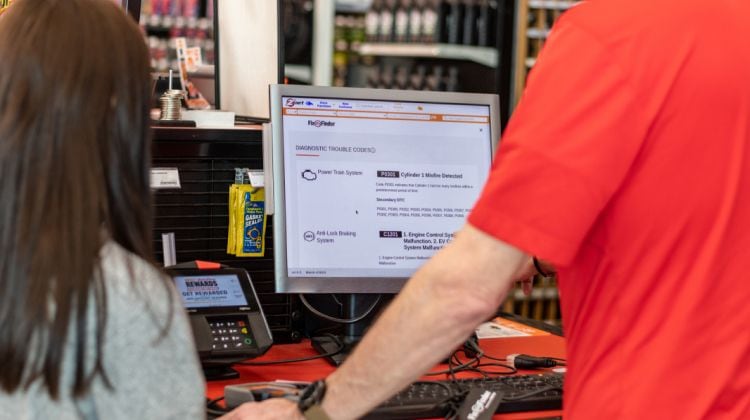 AutoZone employee discussing solutions with customer