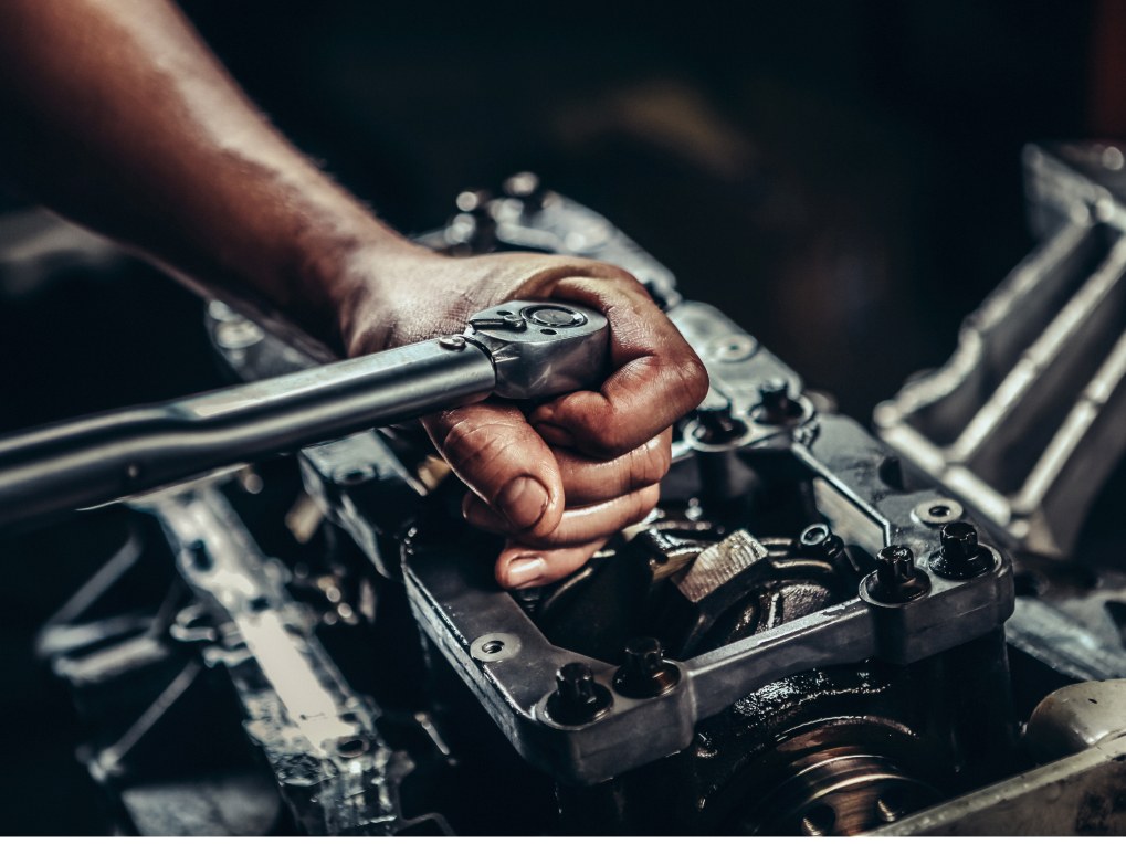 person rebuilding an engine