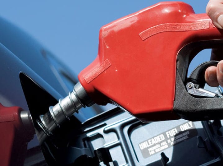 person pumping gas