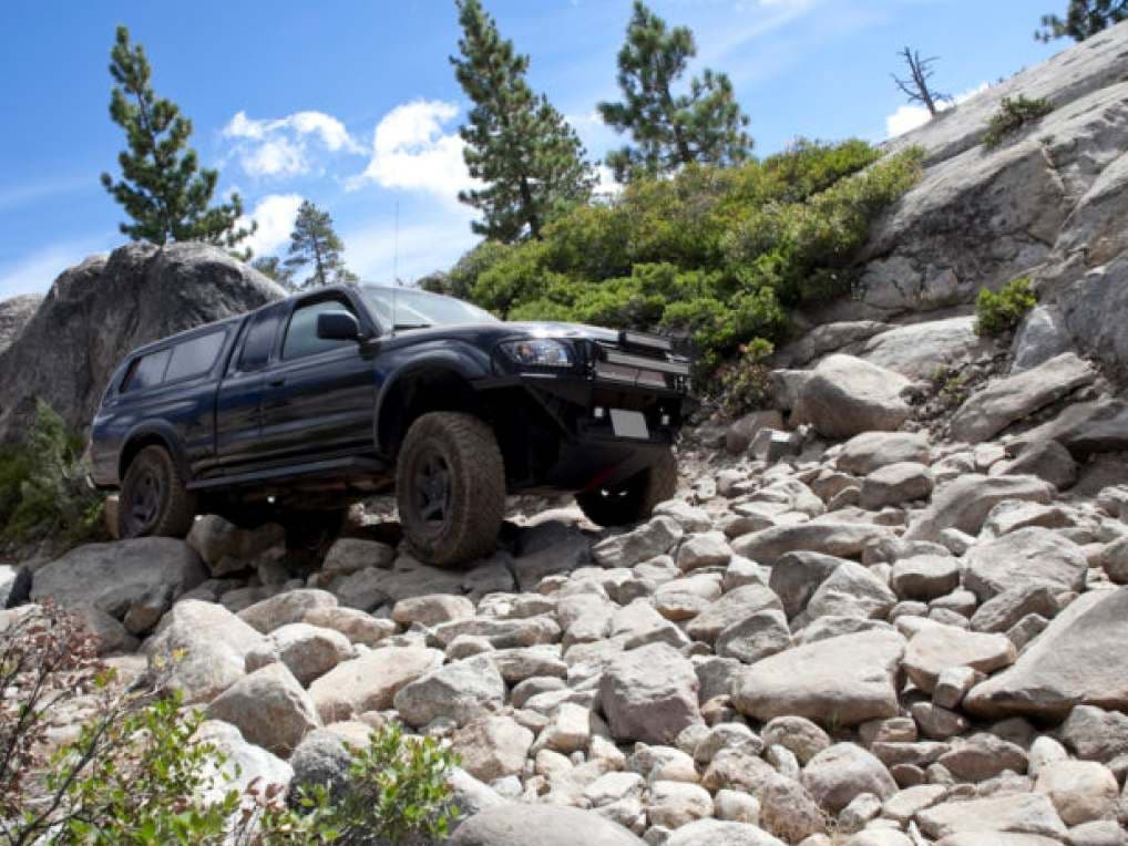 truck driving on rocky terrain