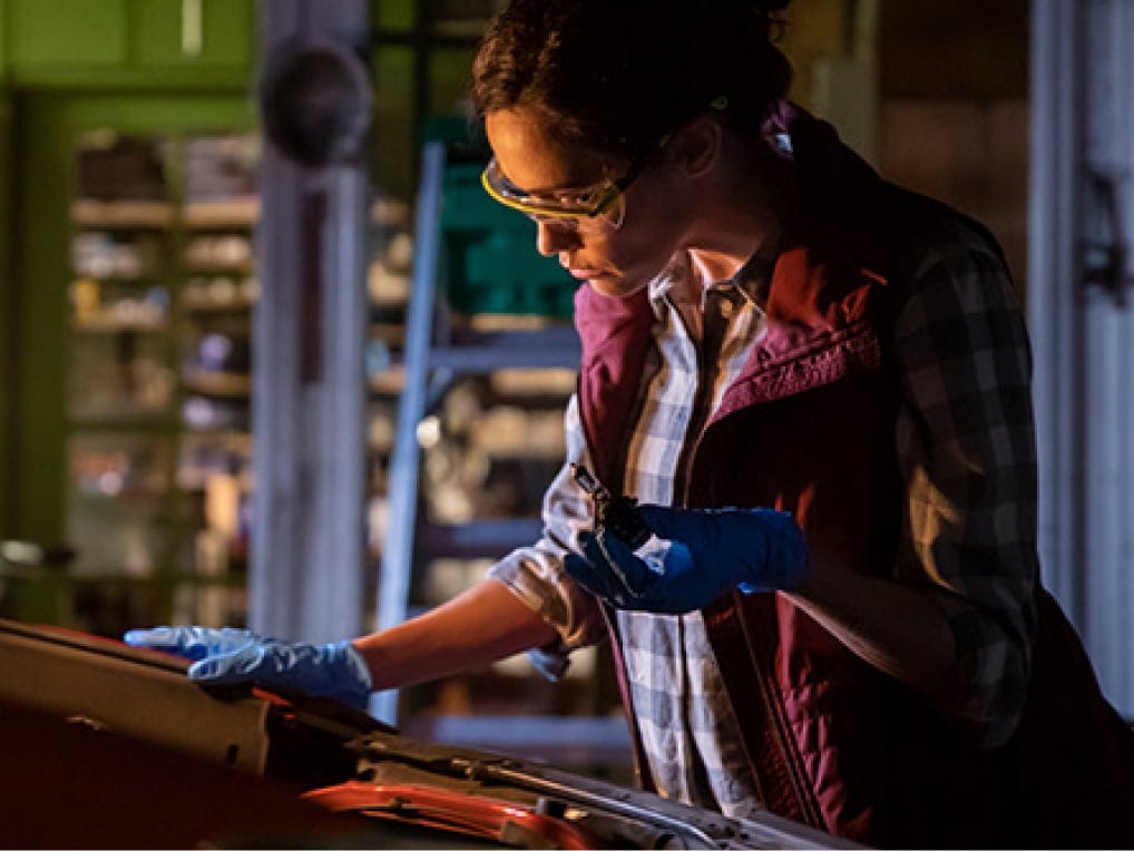 woman replacing headlights
