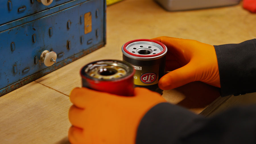 side-by-side comparison of an old and new oil filter