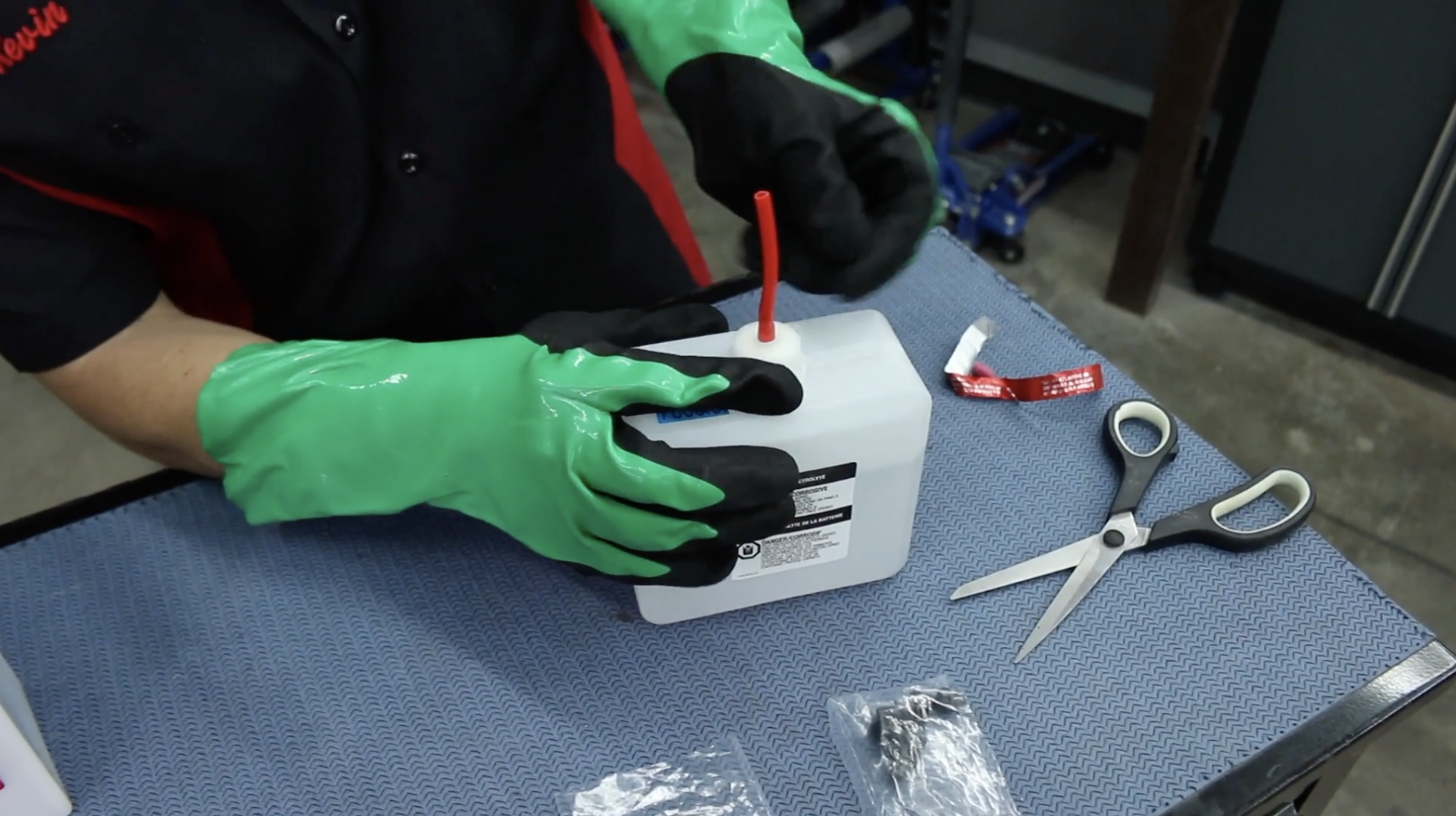 Attaching fill tube to battery acid container for powersport battery setup
