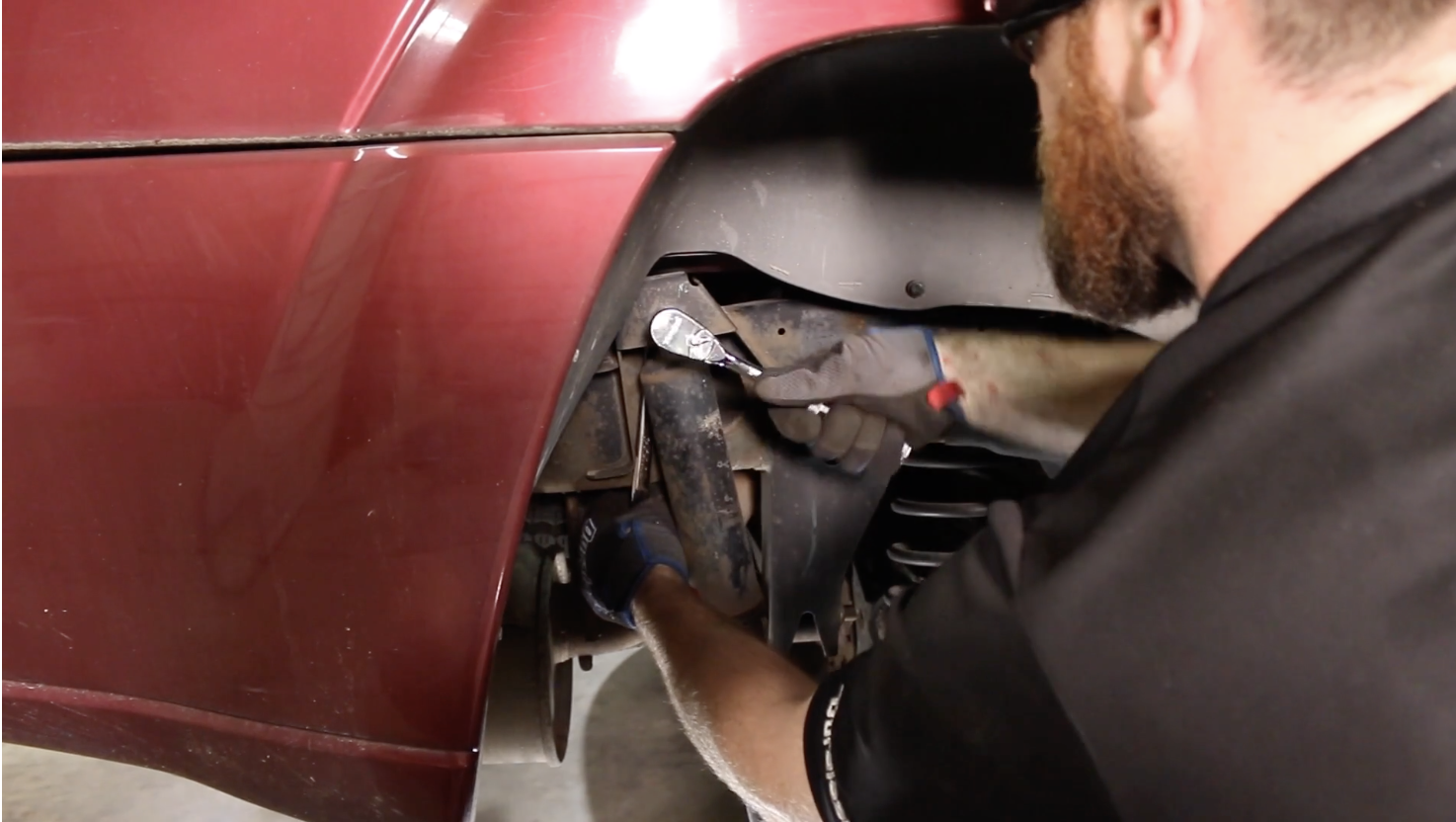 Removing the upper shock bolt and nut