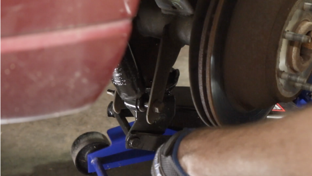 Person installing the bolts on a newly placed strut