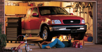 Man preparing to recycle oil after changing his F-150's oil