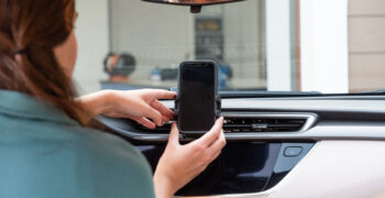 installing phone holder with phone in it on dash back to school