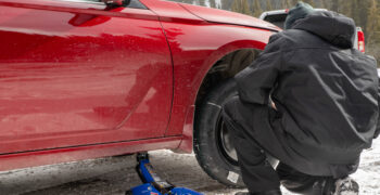 Winter travel tire change in snow duralast Jack