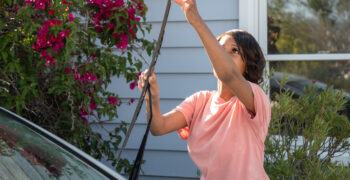 female checking and installing wiper blades 2