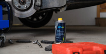 LV DOT4 one liter in front of car wheel off
