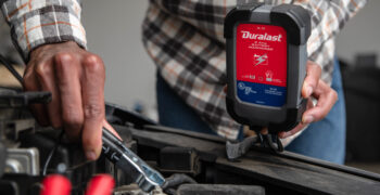 A last DL2D battery charger being installed under hood close up