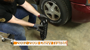 Person showing off a new Duralast loaded strut